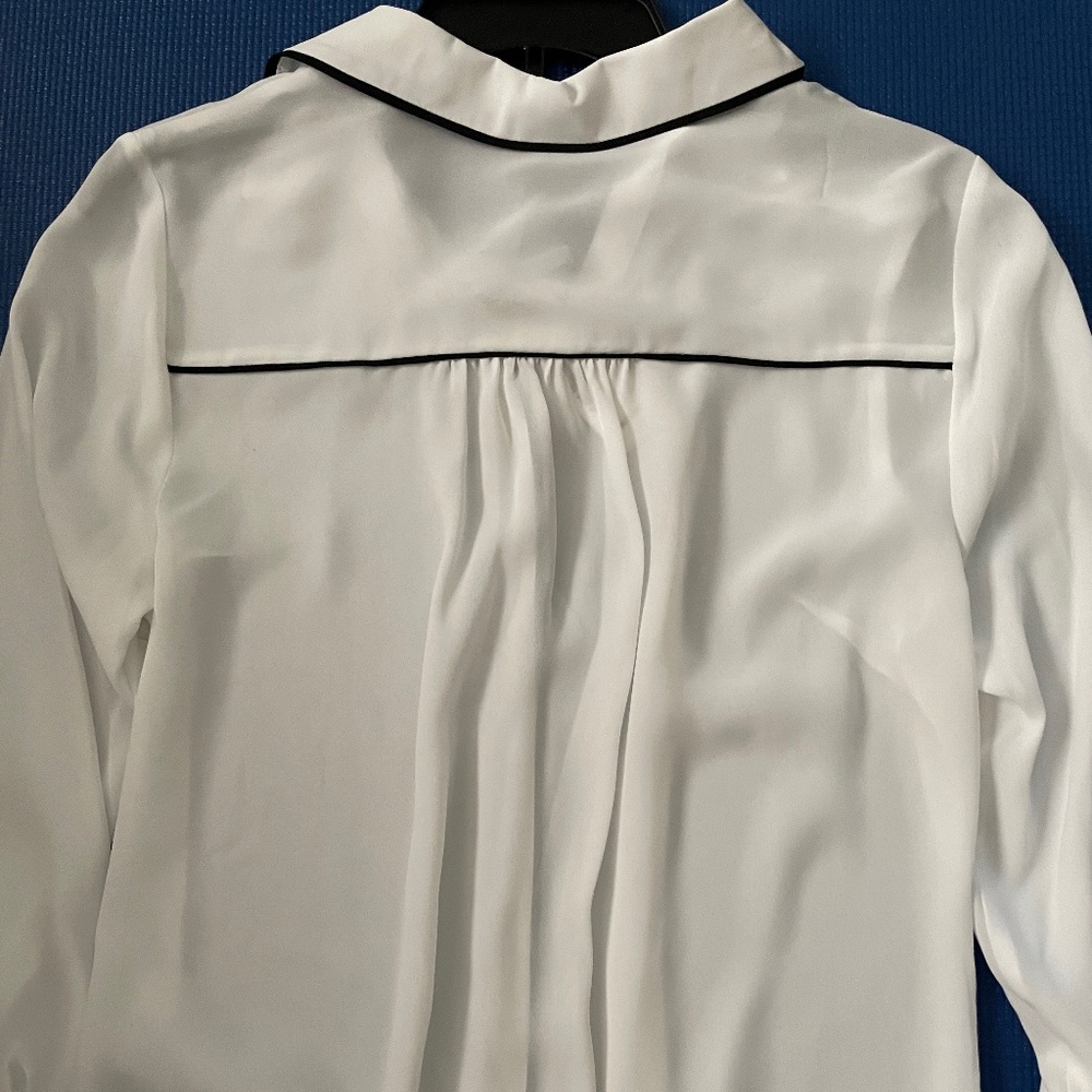 White blouse with black trim